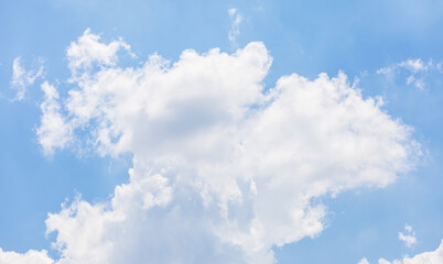 Fluffy White Clouds in a Bright Blue Sky.