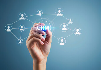 Obraz premium Human Hand Actively Engages with a Glowing CRM Interface, Symbolizing Connected Customer Relationships and Data Networks.