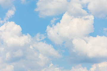 Soft White Clouds in a Pastel Blue Sky