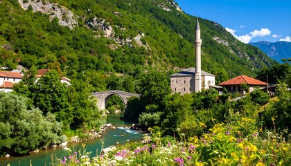Mountain village by a river with a mosque and bridge