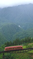 The red monorail funicular and Fansipan mountain views in Sapa, Vietnam