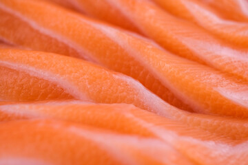 Fresh, juicy salmon cut into pieces for sashimi