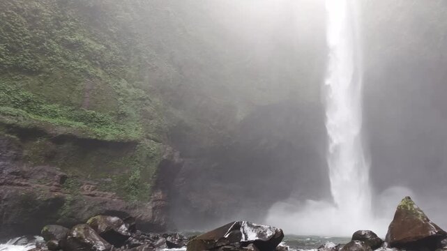 highest waterfalls in the middle of the forest with a very beautiful cliff, the name is Langkuik Tinggi waterfall in West Sumatra	