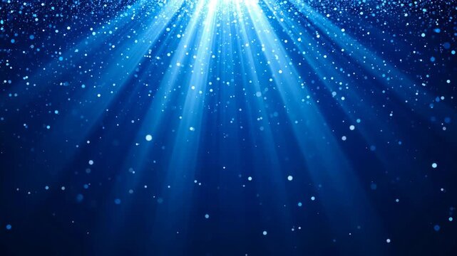 Abstract cinematic blue glitter drop in light beams loop background