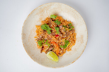 Delight in a vibrant rice dish featuring tender beef, bright herbs, and a hint of lime