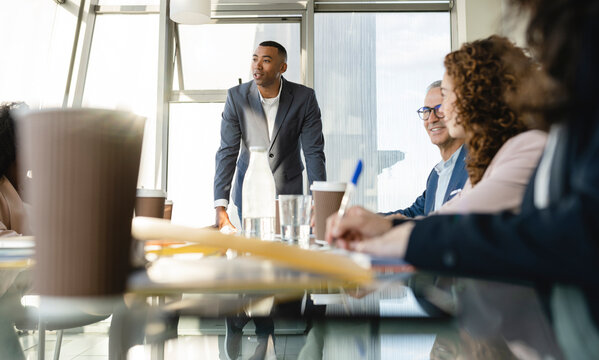 Businessman conducting meeting with colleagues at office