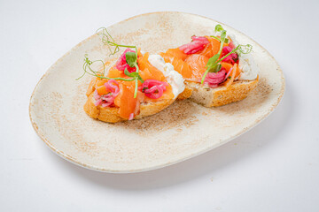 Two open-faced sandwiches showcase vibrant toppings, highlighting culinary creativity and flavor