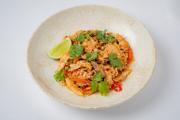 A vibrant seafood fried rice with veggies and herbs elevates the dining experience