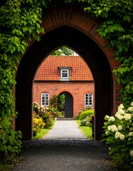 A brick archway leads to a house
