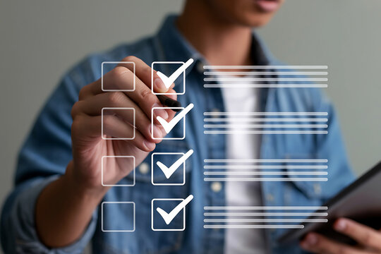 Person checking off items on a digital to do list with a stylus