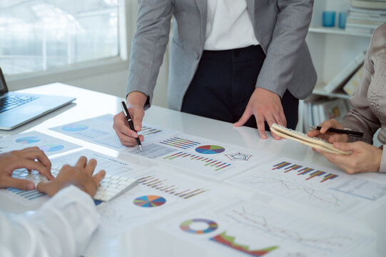 Financial Advisor team working analysis on business report for estimating the capital, planning corporate finance and financial management.