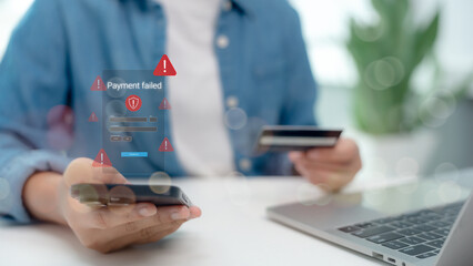 Close-up of a person holding smartphone and credit card with payment failed alert on screen. Concept of online transaction error, card decline, cybersecurity risk, and digital payment failure.
