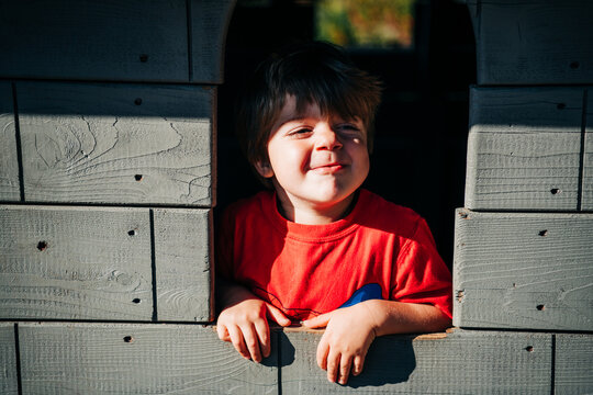 Preschooler having fun in playground structure
