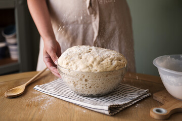 Rising dough in glass bowl, home baking