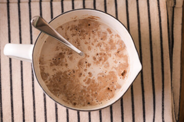 Mixing dry yeast with warm milk, cooking dough for home baking