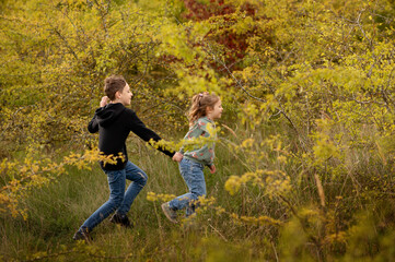 Children running with joy through the park.