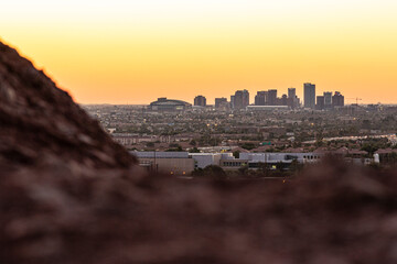 Downtown Phoenix skyline view over rocky foreground