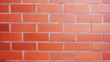 Obraz premium Red Brick Wall with Uniform Pattern and Textured Surface