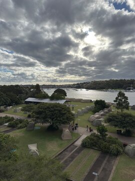View of glamping tents on the ground next to the harbour, Cockatoo Island, Sydney, Australia