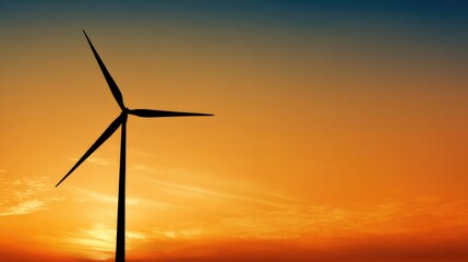Obraz premium Wind turbine against sunset sky, symbolizing clean energy and sustainable future