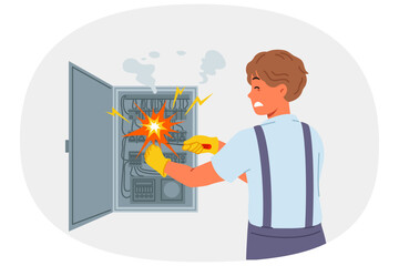 Man electrician is injured by electric shock while repairing electrical panel with high voltage transformers. Repairman became victim of electric shock due to carelessness and lack of professionalism