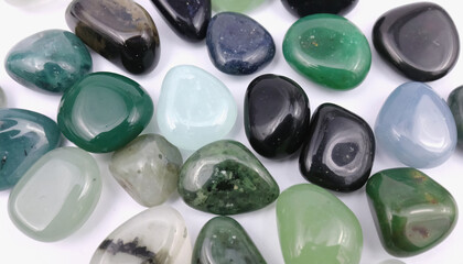 Beautiful assortment of tumbled gems in a bowl with copy space for text and stunning colors and varied shapes