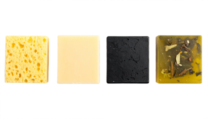 Natural cleansing essentials a bright sponge, creamy bar, charcoal bar, and herbal soap create a clean beauty collection.