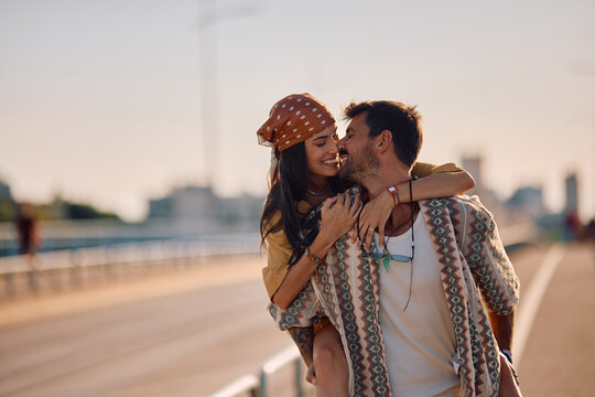 Happy couple in love enjoying in summer day in city.