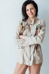 Portrait of Woman Artist Holding Brushes for Painting