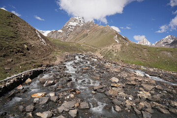 Glacier-Fed River Flowing Through Rocky Landscape on Adi Kailash Route, Himalayas