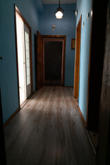 Interior empty blue corridor with doors