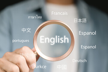 Businessman use Magnifier focus to English language translation or translate on worldwide language conversation speaking concept.