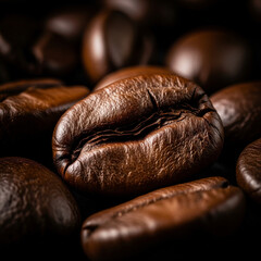 Ultra close-up shot of a roasted coffee bean, showing its detailed texture, rich brown tones, and deep central crease.
