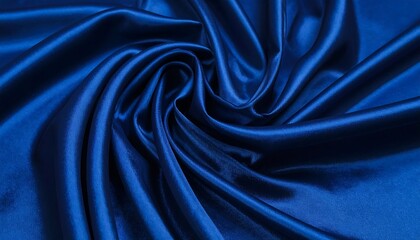 Obraz premium Deep blue satin fabric swirled in soft folds, luxurious texture