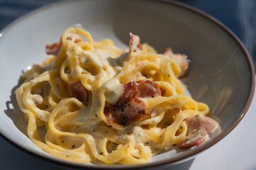 Pasta carbonara served in a cafe. 