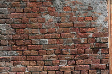brick wall old red brick wall with dust and debris on white background. Broken brick wall with scattered debris and visible cracks.
