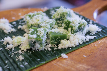 traditional Indonesian dessert, The dessert consists of soft, chewy, bite-sized green cakes, which...