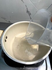 Cooking Process: Water Pouring into Pan Photo