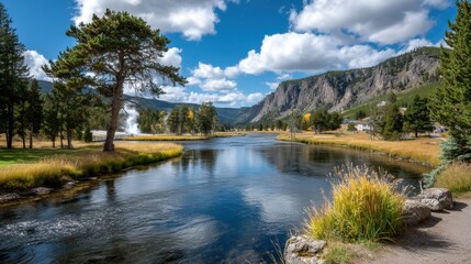 Obraz premium Discover the Serene Beauty of a Majestic River and its Enchanting Waterfall in Nature's Splendor