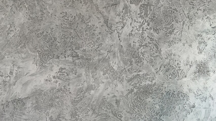 Decorative gray venetian plaster wall background, smooth, seamless luxury stucco surface for architecture, art and highend interior design.
