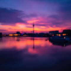 Colorful sunset over city skyline reflected in water.