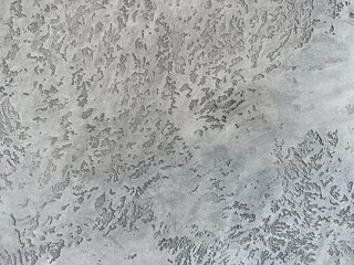 Decorative gray venetian plaster wall background, smooth, seamless luxury stucco surface for architecture, art and highend interior design.
