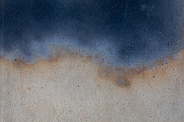 Close-up of abstract concrete surface with dark blue color blending into beige sand stone. Abstract background texture useful for design, grunge, or industrial themes