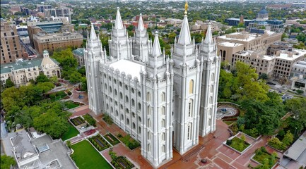 Majestic White Temple Surrounded by Lush Greenery and Urban Landscape in Aerial View, Salt Lake City, Utah