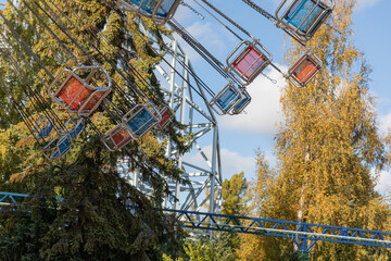 Children's carousels and swings in the amusement park