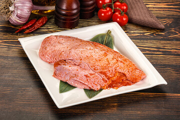 Raw marinated duck breast for cooking