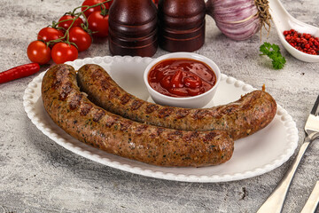 Grilled beef sausages with sauce