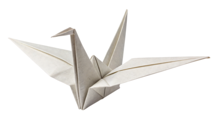 Folded paper origami crane, a Japanese art symbol, flying like a bird on a white background