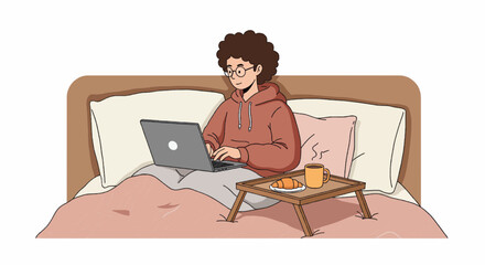 Person working on laptop in bed with coffee and pastries