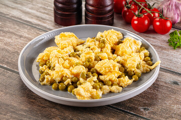 Scrambled egg omelet with green peas